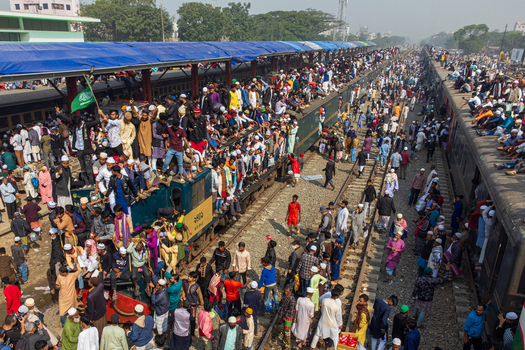 Tongi Bangladesh 04 February 2024 Aerial view of Tongi Junction railway station crowded with people sitting on train roofs and platforms during the Biswa Ijtema festival. Tongi Bangladesh 04 February 2024 Aerial view of Tongi Junction railway station crowded with people sitting on train roofs and platforms during the Biswa Ijtema festival.