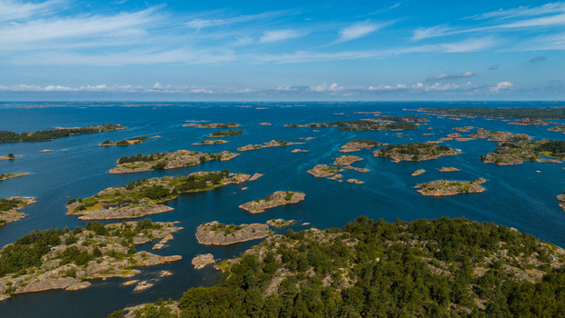 Aerial view of Oro Fortress Island featuring rocky islets dense pine forests and the surrounding Baltic Sea in Oro Varsinais Suomi Finland. Aerial view of Oro Fortress Island featuring rocky islets dense pine forests and the surrounding Baltic Sea in Oro Varsinais Suomi Finland.