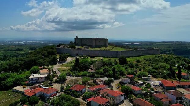 Aerial view of a historic stone fortress on a hilltop Greece.