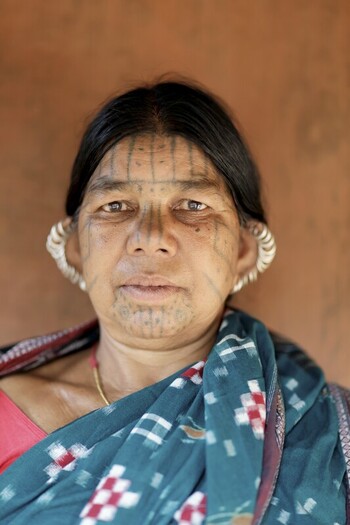 Odisha India 26 March 2026 View of an indigenous woman s face with traditional tattoos her serene gaze framed by the textured backdrop of a rustic wall. Odisha India 26 March 2026 View of an indigenous woman s face with traditional tattoos her serene gaze framed by the textured backdrop of a rustic wall.