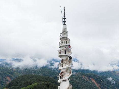 Gampola Sri Lanka 22 February 2026 Aerial view of Ambuluwawa Tower with tourists climbing the spiral staircase overlooking misty green hills and lush forests under a cloudy sky. Gampola Sri Lanka 22 February 2026 Aerial view of Ambuluwawa Tower with tourists climbing the spiral staircase overlooking misty green hills and lush forests under a cloudy sky.