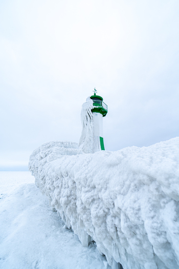View of Molenfeuer Sassnitz covered in thick ice and snow during a cold winter day in Sassnitz Mecklenburg Vorpommern Germany.