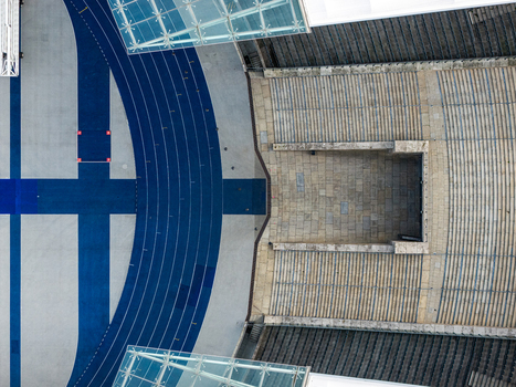 Berlin Germany 26 September 2026 Aerial view of the Olympiastadion Berlin showing the blue running track stone seating tiers and modern glass roof structures.