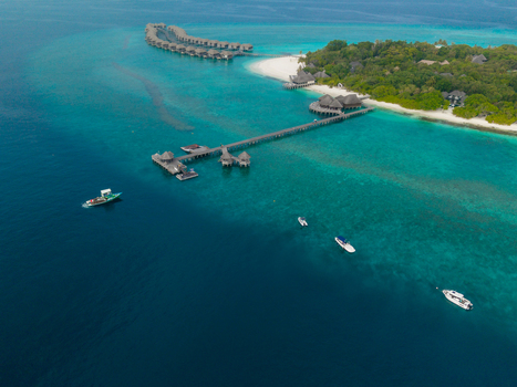 Aerial view of crystal clear turquoise waters contrasting with the pristine white sands and lush greenery Hoarafushi Thiladhunmathee Uthuruburi Maldives. Aerial view of crystal clear turquoise waters contrasting with the pristine white sands and lush greenery Hoarafushi Thiladhunmathee Uthuruburi Maldives.