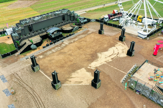 Herzogenaurach Germany 27 July 2025 Aerial view of the Open Beatz Festival stage area featuring a large Ferris wheel and sound equipment on a field. Herzogenaurach Germany 27 July 2025 Aerial view of the Open Beatz Festival stage area featuring a large Ferris wheel and sound equipment on a field.