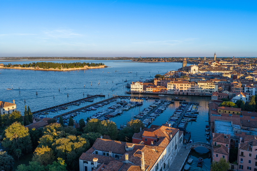 Aerial view of the historic city of Venice with its iconic marina traditional rooftops and surrounding lagoon in Venice Veneto Italy. Aerial view of the historic city of Venice with its iconic marina traditional rooftops and surrounding lagoon in Venice Veneto Italy.