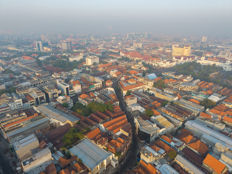 Genteng East Java Indonesia 13 August 2026 Aerial view of Surabaya Old Town featuring historic colonial style buildings dense terracotta rooftops and narrow streets under a soft morning light. Genteng East Java Indonesia 13 August 2026 Aerial view of Surabaya Old Town featuring historic colonial style buildings dense terracotta rooftops and narrow streets under a soft morning light.