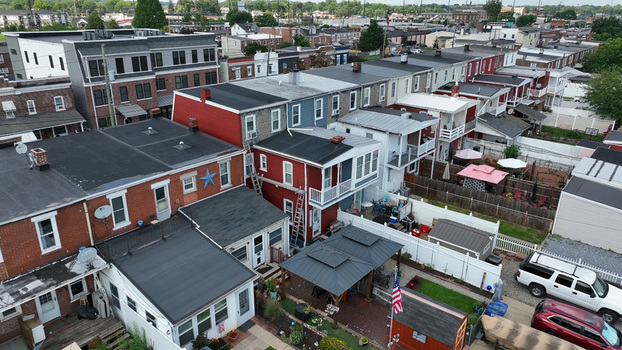 Aerial view of residential row houses with brick facades and small backyards in a neighborhood in Lancaster Pennsylvania United States.