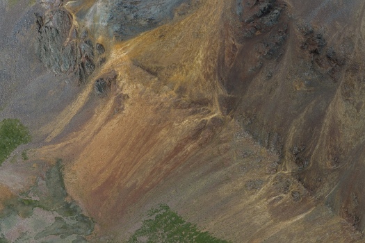 Aerial view of the rugged slopes of Mount Sneffels in the San Juan Mountains featuring rocky terrain and alpine vegetation in Yankee Boy Basin Ouray County Colorado United States. Aerial view of the rugged slopes of Mount Sneffels in the San Juan Mountains featuring rocky terrain and alpine vegetation in Yankee Boy Basin Ouray County Colorado United States.