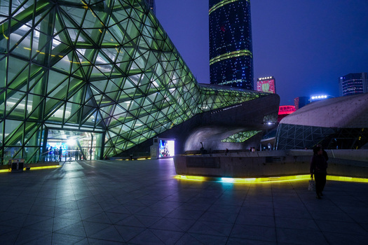 Guangzhou Guangdong Province China 24 February 2024 View of the Guangzhou Opera House with its futuristic glass and steel architecture illuminated at night. Guangzhou Guangdong Province China 24 February 2024 View of the Guangzhou Opera House with its futuristic glass and steel architecture illuminated at night.