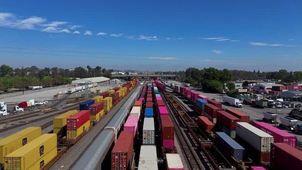 Aerial view of freight trains with colorful containers United States.