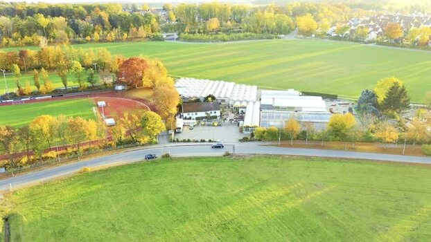 Aerial view of a greenhouse complex and sports field Germany. Aerial view of a greenhouse complex and sports field Germany.