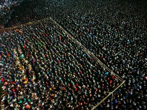 Dhaka Bangladesh 20 July 2026 Aerial view of a massive crowd gathered at Mohsin Hall Playground at night.