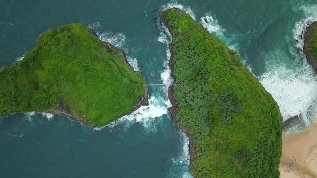 Aerial view of Sedahan Beach cliffs and turquoise sea Indonesia.