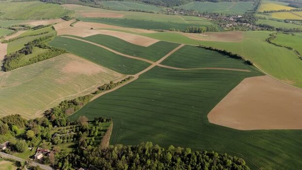 Aerial view of rolling green hills and agricultural fields Czechia. Aerial view of rolling green hills and agricultural fields Czechia.