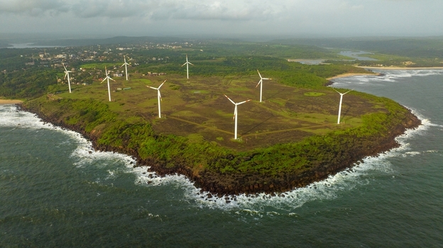 Aerial view of Devgad Windmills on a lush green coastal cliff overlooking the Arabian Sea Devgad Maharashtra India. Aerial view of Devgad Windmills on a lush green coastal cliff overlooking the Arabian Sea Devgad Maharashtra India.