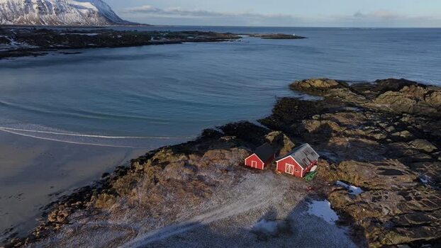 Aerial view of red cabins in Lofoten Norway.