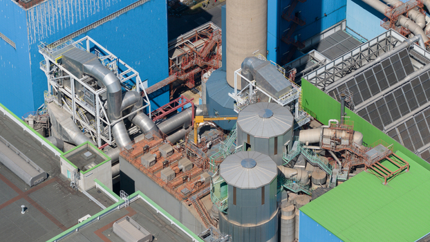 Aerial view of the Abfallkraftwerk Herten waste to energy plant with complex industrial piping chimneys and metal structures Herten Nordrhein Westfalen Germany.