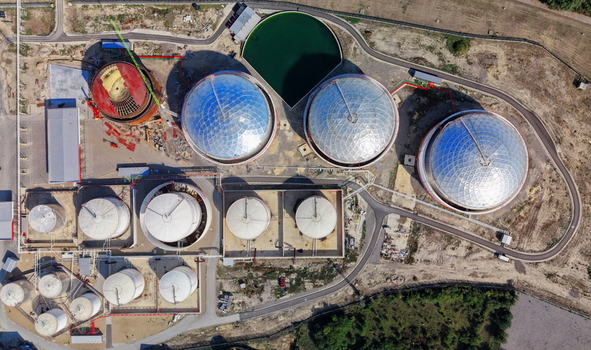 Aerial view of fuel tanks at a storage facility with large spherical and cylindrical tanks some under construction surrounded by roads and sparse vegetation in Kovin Vojvodina Serbia. Aerial view of fuel tanks at a storage facility with large spherical and cylindrical tanks some under construction surrounded by roads and sparse vegetation in Kovin Vojvodina Serbia.