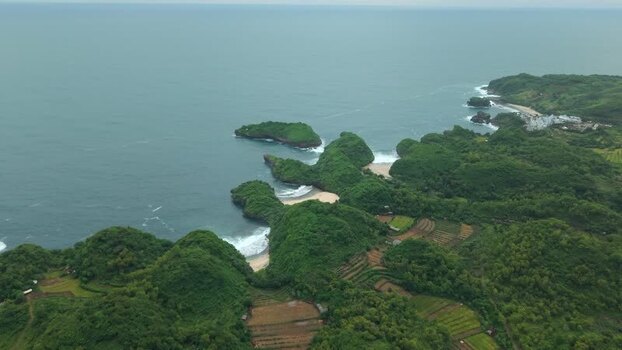 Aerial view of Sedahan Beach and lush coastline Indonesia.