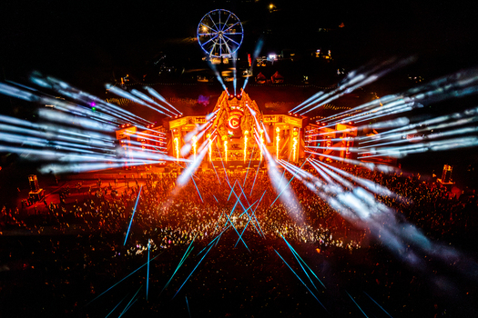 Herzogenaurach Germany 27 July 2025 Aerial view of Open Beatz Festival featuring a massive stage with bright laser lights pyrotechnics and a large crowd at night. Herzogenaurach Germany 27 July 2025 Aerial view of Open Beatz Festival featuring a massive stage with bright laser lights pyrotechnics and a large crowd at night.