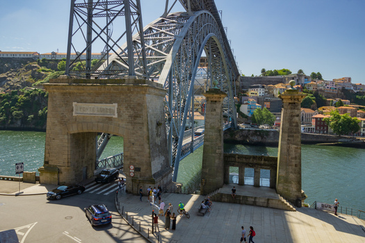 Porto Portugal 13 July 2021 View of the Dom Luís I Bridge its iron arches framing the Douro River and the vibrant cityscape beyond. Porto Portugal 13 July 2021 View of the Dom Luís I Bridge its iron arches framing the Douro River and the vibrant cityscape beyond.