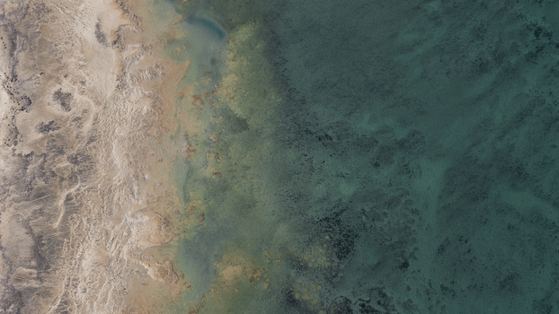 Aerial view of the turquoise blue waters and intricate sand patterns along the coastline of Denham Western Australia Australia. Aerial view of the turquoise blue waters and intricate sand patterns along the coastline of Denham Western Australia Australia.