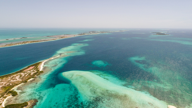 Aerial view of Los Roques archipelago with turquoise waters coral reefs and sandbars in Los Roques Dependencias Federale Venezuela. Aerial view of Los Roques archipelago with turquoise waters coral reefs and sandbars in Los Roques Dependencias Federale Venezuela.