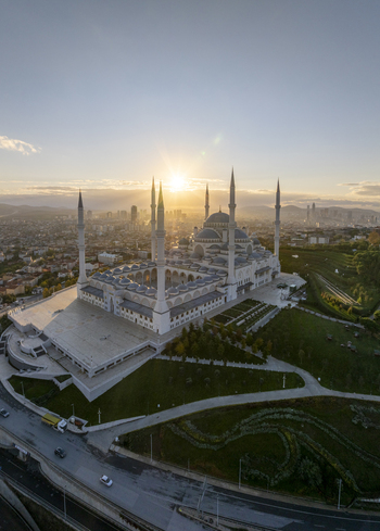 Aerial view of Grand Camlica Mosque with its six minarets and large central dome at sunset overlooking the cityscape of Uskudar Istanbul Turkey. Aerial view of Grand Camlica Mosque with its six minarets and large central dome at sunset overlooking the cityscape of Uskudar Istanbul Turkey.