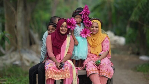 View of women and children with water lilies in Bogura Bangladesh. View of women and children with water lilies in Bogura Bangladesh.