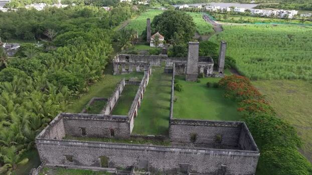 Aerial view of historic sugar mill ruins in Mauritius.