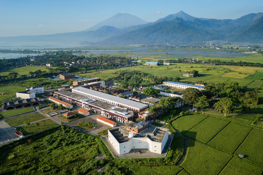 Aerial view of Benteng Fort Willem I surrounded by lush green rice fields and majestic mountains in Ambarawa Central Java Indonesia. Aerial view of Benteng Fort Willem I surrounded by lush green rice fields and majestic mountains in Ambarawa Central Java Indonesia.