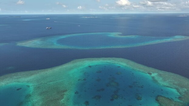 Aerial view of turquoise coral reefs and deep blue ocean Maldives. Aerial view of turquoise coral reefs and deep blue ocean Maldives.