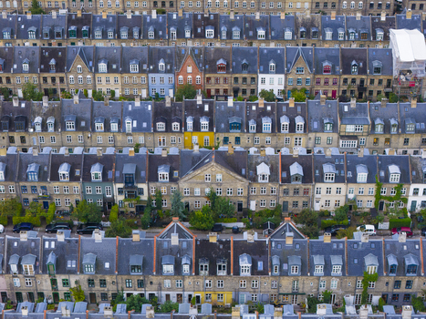 Aerial view of the historic Kartoffelraekkerne terraced houses with colorful facades and dormer windows in Copenhagen Denmark. Aerial view of the historic Kartoffelraekkerne terraced houses with colorful facades and dormer windows in Copenhagen Denmark.
