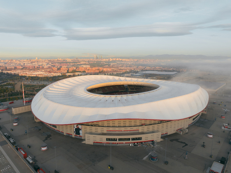 Aerial view of Riyadh Air Metropolitano Stadium with its distinctive white roof and surrounding urban landscape in Madrid Comunidad de Madrid Spain.