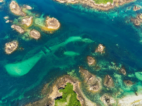 Aerial view of the rocky islets and turquoise waters surrounding the island of Brehat in Ile de Brehat Brittany France.