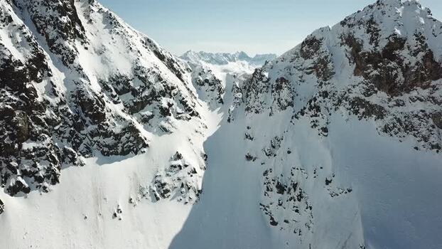 Aerial view of snowy mountain peaks in Baqueira Spain.