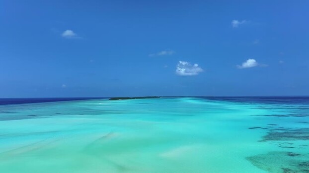 Aerial view of turquoise lagoon and white sandbars under a blue sky Maldives. Aerial view of turquoise lagoon and white sandbars under a blue sky Maldives.