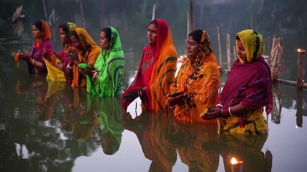 View of women performing a religious ritual in a river Bangladesh. View of women performing a religious ritual in a river Bangladesh.