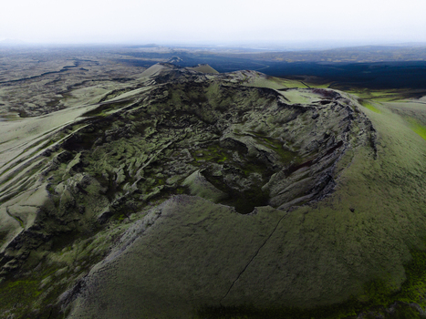 Aerial view of the moss covered Laki craters a stark contrast to the dark lava fields creating an otherworldly landscape Skaftárhreppur Skaftárhreppur Iceland. Aerial view of the moss covered Laki craters a stark contrast to the dark lava fields creating an otherworldly landscape Skaftárhreppur Skaftárhreppur Iceland.