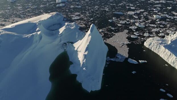 Aerial view of Ilulissat glacier icebergs Greenland.