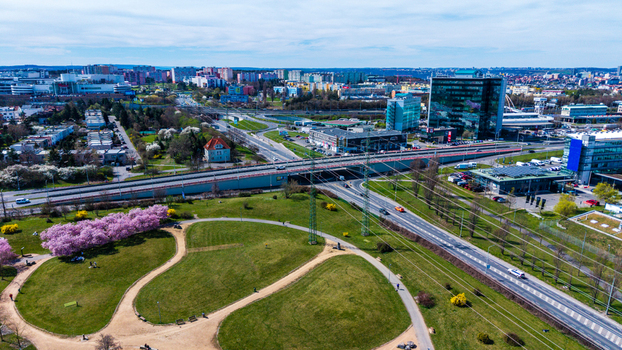 Aerial view of vibrant green parkland contrasting with the sleek modern architecture and winding roads a harmonious blend of nature and urban design Prague Prague Czechia. Aerial view of vibrant green parkland contrasting with the sleek modern architecture and winding roads a harmonious blend of nature and urban design Prague Prague Czechia.