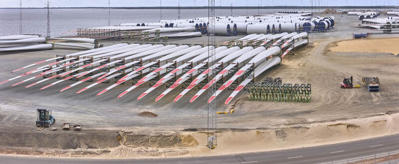 Aerial view of Esbjerg Havn with rows of wind turbine blades stored for transport to offshore wind farms in the North Sea Esbjerg Syddanmark Denmark.