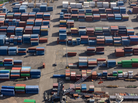 Aerial view of the industrial port of Bajos de Haina with rows of colorful shipping containers and heavy cranes in Bajos de Haina San Cristobal Provinc Dominican Republic.
