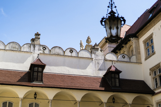 View of the historic courtyard of the Old Town Hall with arched walkways red tiled roofs and ornate architectural details in Bratislava Bratislava Region Slovakia. View of the historic courtyard of the Old Town Hall with arched walkways red tiled roofs and ornate architectural details in Bratislava Bratislava Region Slovakia.