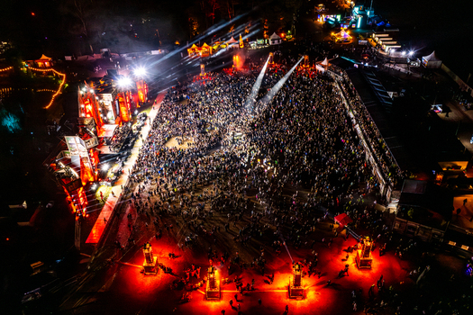 Herzogenaurach Germany 27 July 2025 Aerial view of Open Beatz Festival with a massive crowd illuminated by vibrant stage lights and spotlights at night. Herzogenaurach Germany 27 July 2025 Aerial view of Open Beatz Festival with a massive crowd illuminated by vibrant stage lights and spotlights at night.