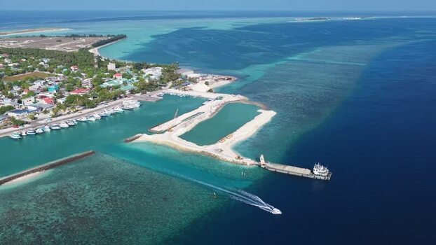 Aerial view of harbor and coastal town of Kudahuvadhoo Maldives. Aerial view of harbor and coastal town of Kudahuvadhoo Maldives.