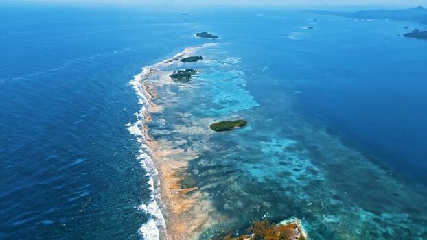 Aerial view of the coral reef and turquoise waters of Guanaja Honduras.