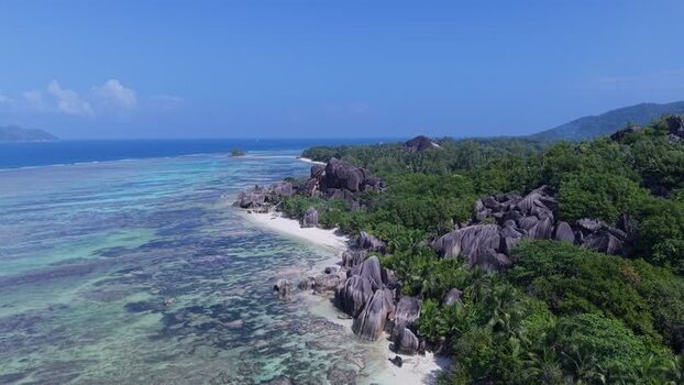 Aerial view of Anse Reunion beach and granite boulders Seychelles.