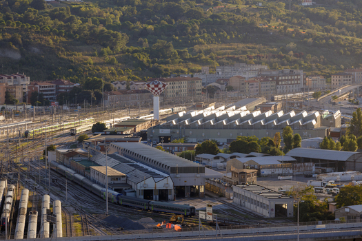 Aerial view of Ancona Port featuring the railway depot with trains industrial buildings and tracks in Ancona Marche Italy. Aerial view of Ancona Port featuring the railway depot with trains industrial buildings and tracks in Ancona Marche Italy.